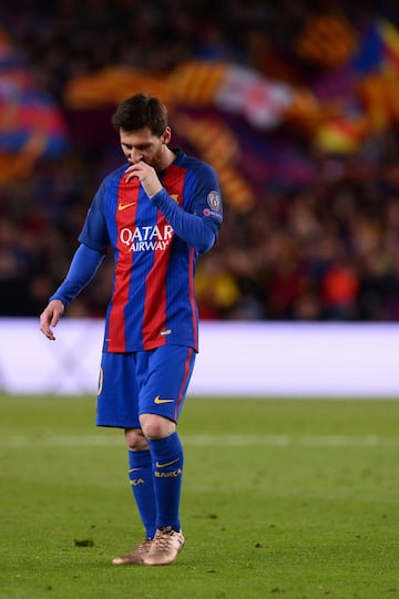 Barcelona's Argentinian forward Lionel Messi walks on the pitch at the end of the UEFA Champions League quarter-final second leg football match FC Barcelona vs Juventus at the Camp Nou stadium in Barcelona on April 19, 2017.