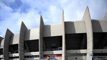 People walk in front of the Parc des Princes stadium in Paris, on March 9, 2020 two days ahed of the UEFA Champions League Group A football match between Paris Saint-Germain (PSG) and Dortmund. - Champions League round of 16 return leg football match betw