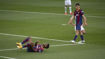 Ansu Fati lies in pain after suffering a knee injury against Real Betis in November.