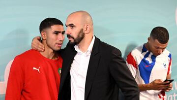 AL KHOR, QATAR - DECEMBER 14: Walid Regragui, Head Coach of Morocco, embraces Achraf Hakimi in the tunnel during the FIFA World Cup Qatar 2022 semi final match between France and Morocco at Al Bayt Stadium on December 14, 2022 in Al Khor, Qatar. (Photo by Michael Regan - FIFA/FIFA via Getty Images)