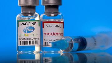 FILE PHOTO: Vials with Pfizer-BioNTech and Moderna coronavirus disease (COVID-19) vaccine labels are seen in this illustration picture taken March 19, 2021. REUTERS/Dado Ruvic/Illustration/File Photo