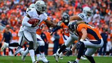 DENVER, CO - OCTOBER 1: Punter Marquette King #7 of the Oakland Raiders carries the ball on a fake punt play before being hit by tight end A.J. Derby #83 of the Denver Broncos at Sports Authority Field at Mile High on October 1, 2017 in Denver, Colorado. (Photo by Dustin Bradford/Getty Images)