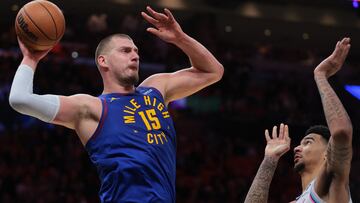Jan 17, 2025; Miami, Florida, USA; Denver Nuggets center Nikola Jokic (15) protects the basketball from Miami Heat center Kel'el Ware (7) during the first quarter at Kaseya Center. Mandatory Credit: Sam Navarro-Imagn Images