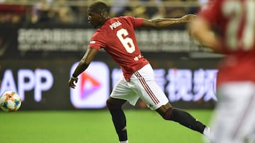 Manchester United's Paul Pogba with the ball during the International Champions Cup football tournament between English Premier League sides Manchester United and Tottenham at Hongkou Football Stadium in Shanghai on July 25, 2019. (Photo by HECTOR RE