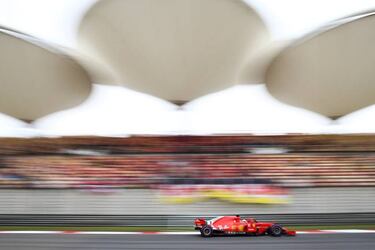 Vettel snatches pole from Raikkonen as Ferrari dominate in Shanghai