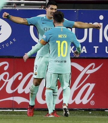 Lionel Messi and Luis Suarez celebrate a goal against Eibar on Sunday night