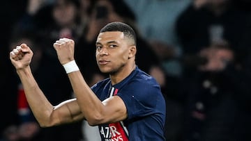 Paris Saint-Germain's French forward #07 Kylian Mbappe celebrates scoring his team's first goal during the UEFA Champions League round of 16 first leg football match between Paris Saint-Germain (PSG) and Real Sociedad at the Parc des Princes Stadium in Paris, on February 14, 2024. (Photo by MIGUEL MEDINA / AFP)