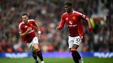 Manchester United's English striker #10 Marcus Rashford runs with the ball during the English Premier League football match between Manchester United and Liverpool at Old Trafford in Manchester, north west England, on September 1, 2024. (Photo by Paul ELLIS / AFP) / RESTRICTED TO EDITORIAL USE. No use with unauthorized audio, video, data, fixture lists, club/league logos or 'live' services. Online in-match use limited to 120 images. An additional 40 images may be used in extra time. No video emulation. Social media in-match use limited to 120 images. An additional 40 images may be used in extra time. No use in betting publications, games or single club/league/player publications. /