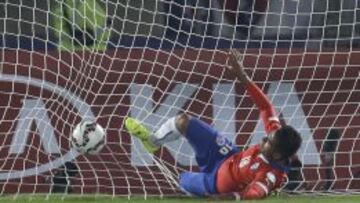 Chile's Gonzalo Jara fails to stop a goal by Mexico's Matias Vuoso, not pictured, during a Copa America Group A soccer match at El Nacional stadium in Santiago, Chile, Monday, June 15, 2015. (AP Photo/Natacha Pisarenko)