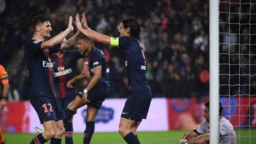 Paris Saint-Germain's Belgian defender Thomas Meunier and Paris Saint-Germain's Uruguayan forward Edinson Cavani celebrate after Paris Saint-Germain's French forward Kylian Mbappe scored a goal during the French L1 football match between P