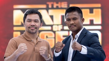 Filipino boxer Manny Pacquiao (L) and Thai Muay Thai fighter Buakaw Banchamek (R) pose for photographs during a press conference in Bangkok on July 21, 2023, to promote their 2024 fight. (Photo by Jack TAYLOR / AFP)