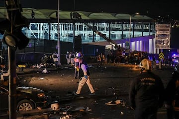 Forensic officers work at the site where a car bomb exploded near the stadium of football club Besiktas.