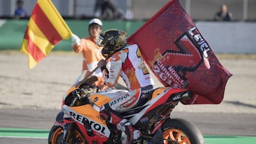 MOTEGI, JAPAN - OCTOBER 21: Marc Marquez of Spain and Repsol Honda Team celebrates with flag the MotoGP victory and becoming the 2018 MotoGP champion at the end of the MotoGP race during the MotoGP of Japan - Race at Twin Ring Motegi on October 21, 2018 in Motegi, Japan. (Photo by Mirco Lazzari gp/Getty Images)