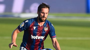 LA NUCIA, SPAIN - JULY 06:  Mikel Oyarzabal of Real Sociedad is brought down by Jorge Miramon of Levante UD during the Liga match between Levante UD and Real Sociedad at Estadi Olimpic Camilo Cano on July 06, 2020 in La Nucia, Spain. Football Stadiums aro