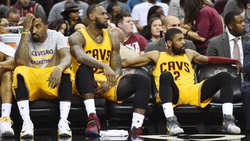 Mar 25, 2017; Cleveland, OH, USA; Cleveland Cavaliers guard JR Smith (5) and forward LeBron James (23) and guard Kyrie Irving (2) watch from the bench during the fourth quarter against the Washington Wizards at Quicken Loans Arena. The Wizards won 127-115. Mandatory Credit: Ken Blaze-USA TODAY Sports