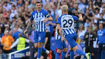 Brighton's English defender #05 Lewis Dunk (L) celebrates after scoring their second goal during the English Premier League football match between Brighton and Hove Albion and Liverpool at the American Express Community Stadium in Brighton, southern England on October 8, 2023. (Photo by Glyn KIRK / AFP) / RESTRICTED TO EDITORIAL USE. No use with unauthorized audio, video, data, fixture lists, club/league logos or 'live' services. Online in-match use limited to 120 images. An additional 40 images may be used in extra time. No video emulation. Social media in-match use limited to 120 images. An additional 40 images may be used in extra time. No use in betting publications, games or single club/league/player publications. / 