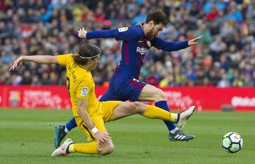 Filipe Luis y Lionel Messi