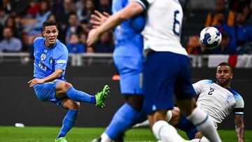 Italy's midfielder Giacomo Raspadori (L) scores a goal during the UEFA Nations League's League A Group 3 match between Italy and England, at the San Siro Stadium in Milan on September 23, 2022.