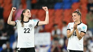 Germany's midfielder #22 Jule Brand and Germany's forward #15 Selina Cerci celebrate after winning the UEFA Women's Euro 2025 quarter finals football match between France and Germany at the Parc Saint-Jacques (St. Jakob Park) stadium in Basel, on July 20, 2025. (Photo by SEBASTIEN BOZON / AFP)