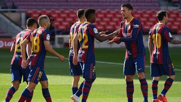 Barcelona's Spanish midfielder Ansu Fati (C) celebrates with teammates after scoring a goal during the Spanish League football match between Barcelona and Real Madrid at the Camp Nou stadium in Barcelona on October 24, 2020. (Photo by LLUIS GENE / AF
