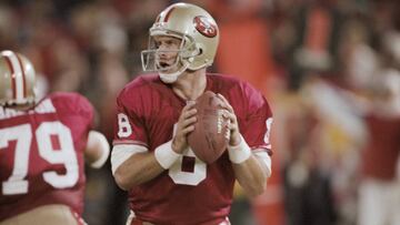 SAN FRANCISCO, CA - SEPTEMBER 13: Steve Young #8 of the San Francisco 49ers throws a pass during a rainy National Football League game against the Buffalo Bills played on September 13, 1992 at Candlestick Park in San Francisco, California. (Photo by David Madison/Getty Images)