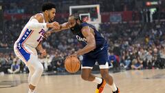 Los Angeles Clippers guard James Harden (1) is defended by Philadelphia 76ers guard Buddy Hield (17) as he drives to the basket in the first half at Crypto.com Arena.