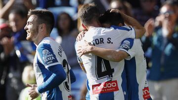 BARCELONA, SPAIN - NOVEMBER 24: Wu Lei of RCD Espanyol celebrates with teammates Victor Campuzano and Victor Sanchez after scoring his side's first goal during the Liga match between RCD Espanyol and Getafe CF at RCDE Stadium on November 24, 2019 in