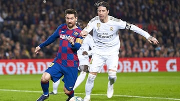 BARCELONA, SPAIN - DECEMBER 18: Lionel Messi of FC Barcelona competes for the ball with Sergio Ramos of Real Madrid during the Liga match between FC Barcelona and Real Madrid CF at Camp Nou on December 18, 2019 in Barcelona, Spain. (Photo by Quality Sport