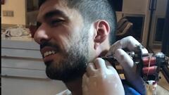 Luis Suárez gets his goal celebration tattooed on his neck