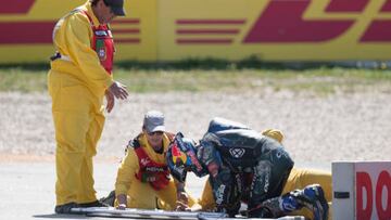 LAGOA, ALGARVE, PORTUGAL - MARCH 26: Miguel Oliveira of Portugal and Cryptodata RNF MotoGP Team with medical staff after crashing out during the MotoGP Of Portugal - Race at Autodromo do Algarve on March 26, 2023 in Lagoa, Algarve, Portugal. (Photo by Mirco Lazzari gp/Getty Images)