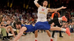 Barcelona's Spanish guard #08 Dario Brizuela falls next to AS Monaco's French centre #32 Matthew Strazel during the Euroleague basketball quarter-final match 4 between FC Barcelone and AS Monaco at the Palau Blaugrana arena in Barcelona, on May 2, 2025. (Photo by MANAURE QUINTERO / AFP)
