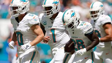 MIAMI GARDENS, FLORIDA - SEPTEMBER 24: Tua Tagovailoa #1 of the Miami Dolphins celebrates with De'Von Achane #28 of the Miami Dolphins after Achane's rushing touchdown during the first quarter against the Denver Broncos at Hard Rock Stadium on September 24, 2023 in Miami Gardens, Florida.   Carmen Mandato/Getty Images/AFP (Photo by Carmen Mandato / GETTY IMAGES NORTH AMERICA / Getty Images via AFP)