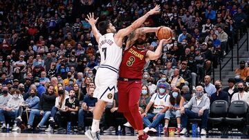 Oct 25, 2021; Denver, Colorado, USA; Cleveland Cavaliers guard Ricky Rubio (3) controls the ball as Denver Nuggets guard Facundo Campazzo (7) defends in the third quarter at Ball Arena. Mandatory Credit: Isaiah J. Downing-USA TODAY Sports