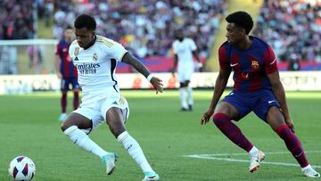 Real Madrid's Brazilian forward #11 Rodrygo (L) is challenged by Barcelona's Spanish defender #03 Alejandro Balde during the Spanish league football match between FC Barcelona and Real Madrid CF at the Estadi Olimpic Lluis Companys in Barcelona on October 28, 2023. (Photo by LLUIS GENE / AFP)