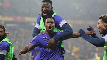 Monaco's Spanish forward #31 Ansu Fati (C) celebrates with teammates after scoring his team's third goal during the French L1 football match between Lens (RCL) and Monaco (ASM) at the Stade Bollaert-Delelis stadium in Lens on February 21, 2026. (Photo by Francois LO PRESTI / AFP)