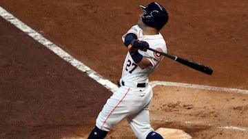 Oct 5, 2017; Houston, TX, USA; Houston Astros second baseman Jose Altuve (27) hits a solo home run during the first inning against the Boston Red Sox in game one of the 2017 ALDS playoff baseball series at Minute Maid Park. Mandatory Credit: Shanna Lockwood-USA TODAY Sports