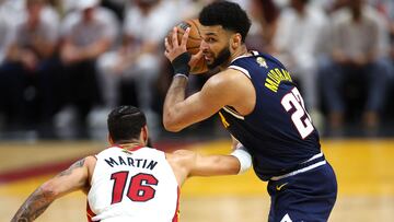 MIAMI, FLORIDA - JUNE 09: Jamal Murray #27 of the Denver Nuggets controls the ball against Caleb Martin #16 of the Miami Heat during the second quarter in Game Four of the 2023 NBA Finals at Kaseya Center on June 09, 2023 in Miami, Florida. NOTE TO USER: User expressly acknowledges and agrees that, by downloading and or using this photograph, User is consenting to the terms and conditions of the Getty Images License Agreement.   Mike Ehrmann/Getty Images/AFP (Photo by Mike Ehrmann / GETTY IMAGES NORTH AMERICA / Getty Images via AFP)