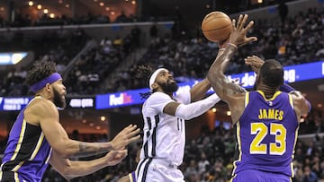 Feb 25, 2019; Memphis, TN, USA; Memphis Grizzlies guard Mike Conley (11) goes to the basket against Los Angeles Lakers forward LeBron James (23) during the second half at FedExForum. Mandatory Credit: Justin Ford-USA TODAY Sports