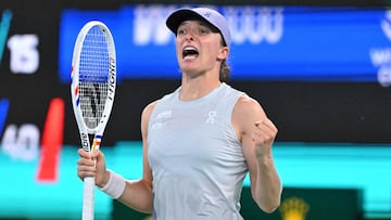 TOPSHOT - Poland's Iga Swiatek celebrates beating Switzerland's Belinda Bencic in their women�s singles match at the Wuhan Open tennis tournament in Wuhan, central China�s Hubei province on October 9, 2025. (Photo by ADEK BERRY / AFP)