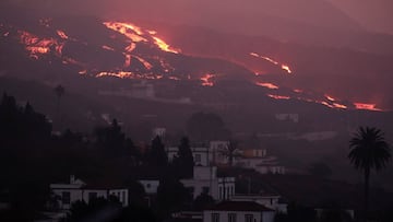 Lava flows down a hill spewed by the Cumbra Vieja volcano as it continues to erupt on the Canary Island of La Palma, as seen from Tajuya, Spain, October 16, 2021. REUTERS/Sergio Perez