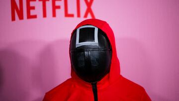 FILE PHOTO: A person dressed as a guard from the Netflix series Squid Game attends a premiere for Squid Game: Season 2, in Los Angeles, California, U.S., December 12, 2024. REUTERS/Daniel Cole/File Photo