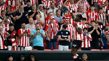 Athletic Bilbao's Spanish forward #10 Nico Williams celebrates scoring the opening goal from the penalty spot during the Spanish league football match between Athletic Club Bilbao and Sevilla FC at San Mames Stadium in Bilbao on August 17, 2025. (Photo by ANDER GILLENEA / AFP)