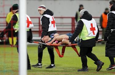 Filipe Luis stretchered off with a suspected fractured shin bone