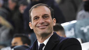 Juventus' coach Massimiliano Allegri smiles before the match against Bologna.