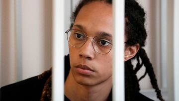 WNBA star and two-time Olympic gold medalist Brittney Griner sits in a cage at a court room prior to a hearing, in Khimki, Russia.