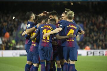 Messi celebrates with his teammates after scoring.