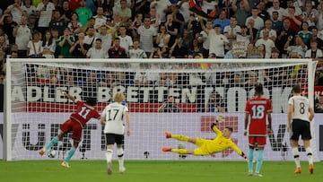 Colombia's midfielder Juan Cuadrado (L) score the 0-2 from the penalty spot past Germany's goalkeeper Marc-Andre Ter Stegen during the international friendly football match between Germany and Colombia in Gelsenkirchen, western Germany on June 20, 2023. (Photo by Odd ANDERSEN / AFP)