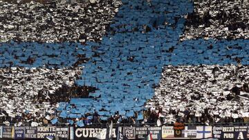 Napoli supporters fly flags during their Europa League round of 32, first leg soccer match against Villarreal at the San Paolo stadium in Naples 