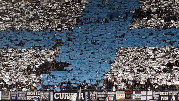 Napoli supporters fly flags during their Europa League round of 32, first leg soccer match against Villarreal at the San Paolo stadium in Naples