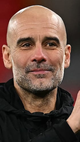Manchester City's Spanish manager Pep Guardiola waves at the end of his team's victory in the English Premier League football match between Liverpool and Manchester City at Anfield in Liverpool, north west England on February 8, 2026. (Photo by Paul ELLIS / AFP) / RESTRICTED TO EDITORIAL USE. No use with unauthorized audio, video, data, fixture lists, club/league logos or 'live' services. Online in-match use limited to 120 images. An additional 40 images may be used in extra time. No video emulation. Social media in-match use limited to 120 images. An additional 40 images may be used in extra time. No use in betting publications, games or single club/league/player publications. /